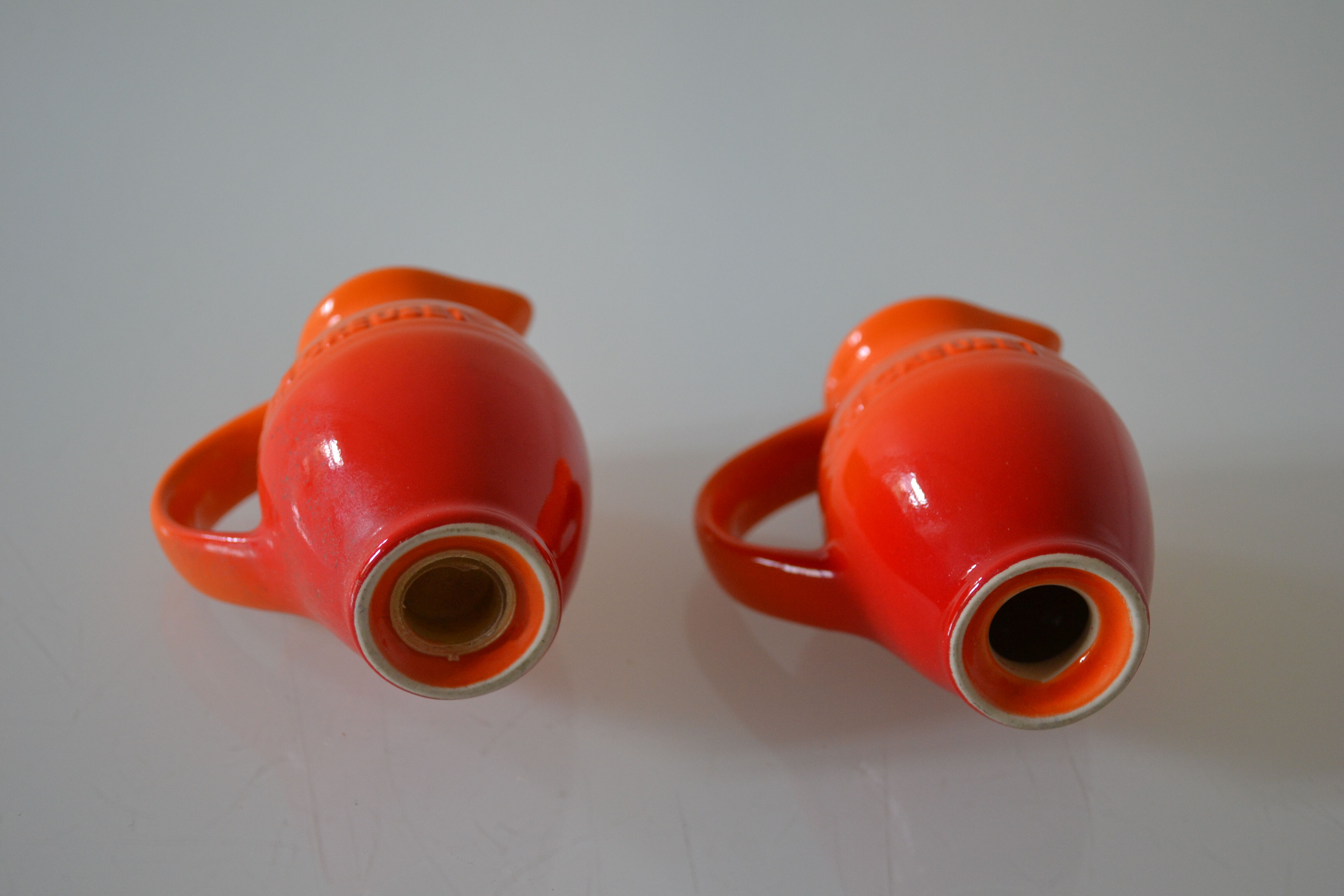 Le Creuset orange advertising salt and pepper
