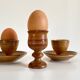 Trio of vintage ceramic and wood egg cups