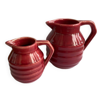 2 small red Onnaing art deco milk and cream jugs