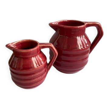 2 small red Onnaing art deco milk and cream jugs