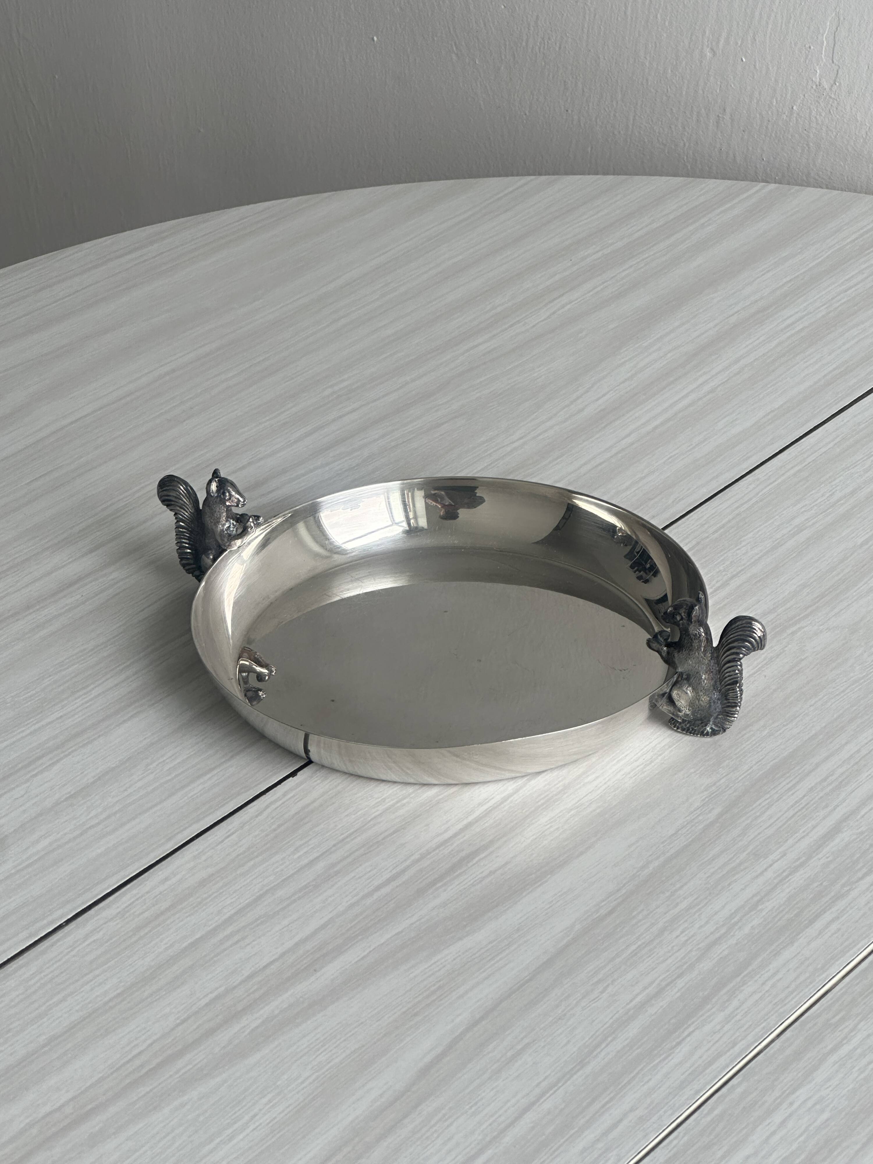 Small shiny silver metal dish