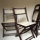 Set de quatre chaises pliantes en bois et cannage