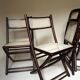 Set de quatre chaises pliantes en bois et cannage