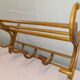 Coat rack with curved wooden hat holder