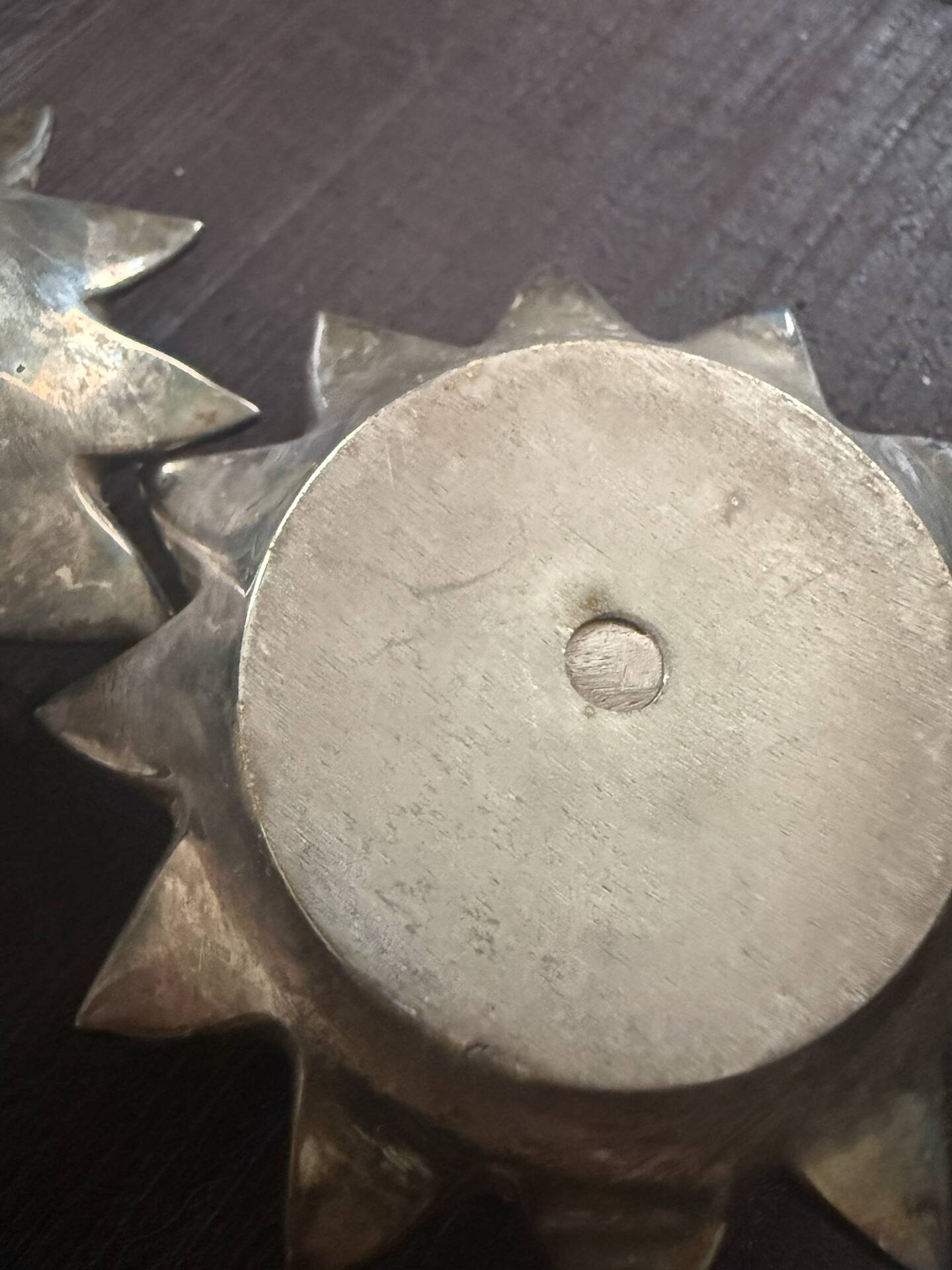 Pair of brass candle holders in the shape of a lotus flower.