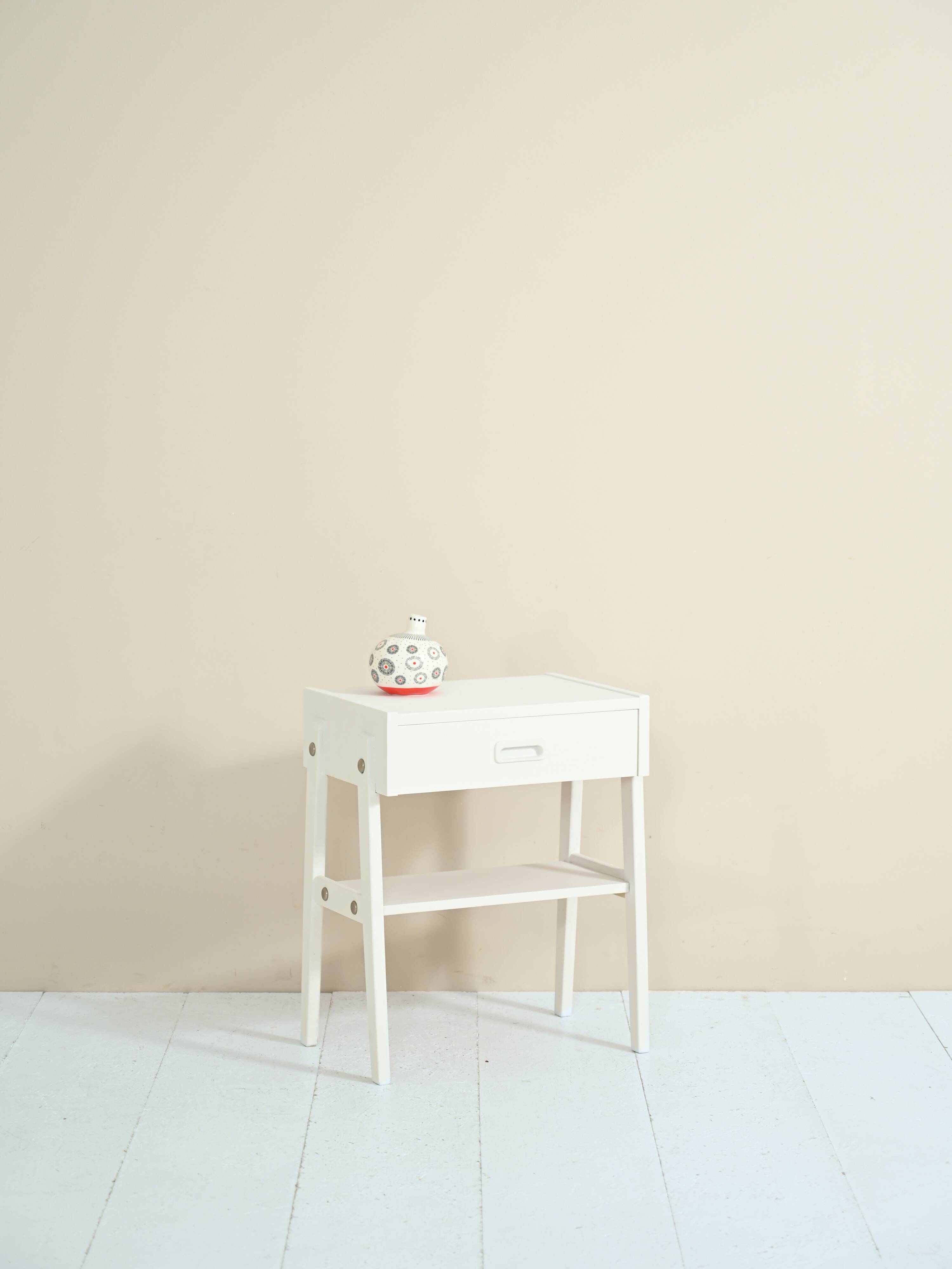 Scandinavian bedside table painted in white