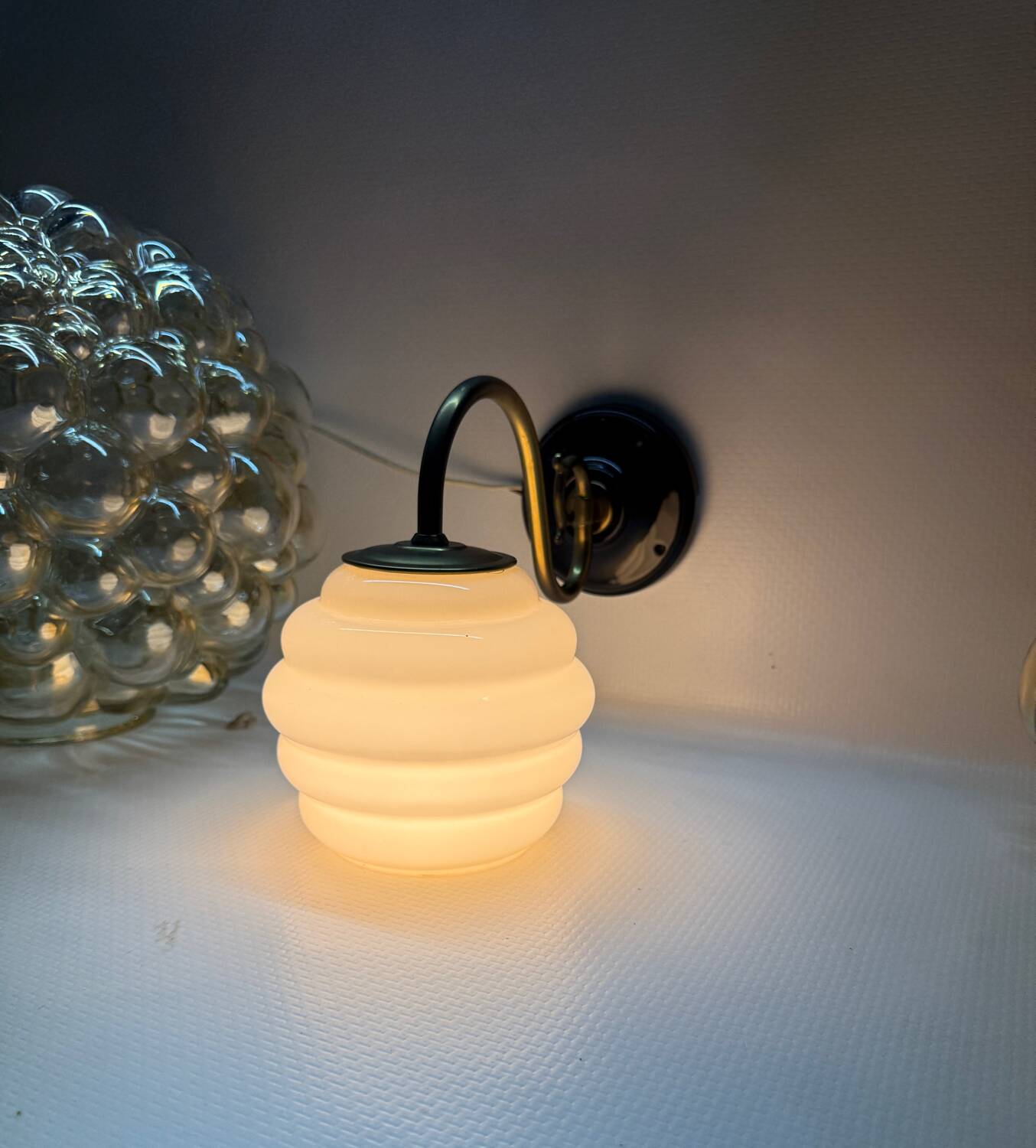 Brass and glass swan neck wall lights