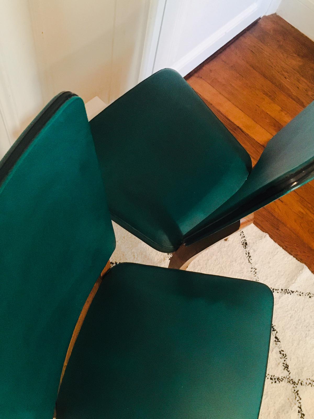 Two 1950s chairs made of wood and skai