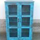 Glass cabinet in old blue wood