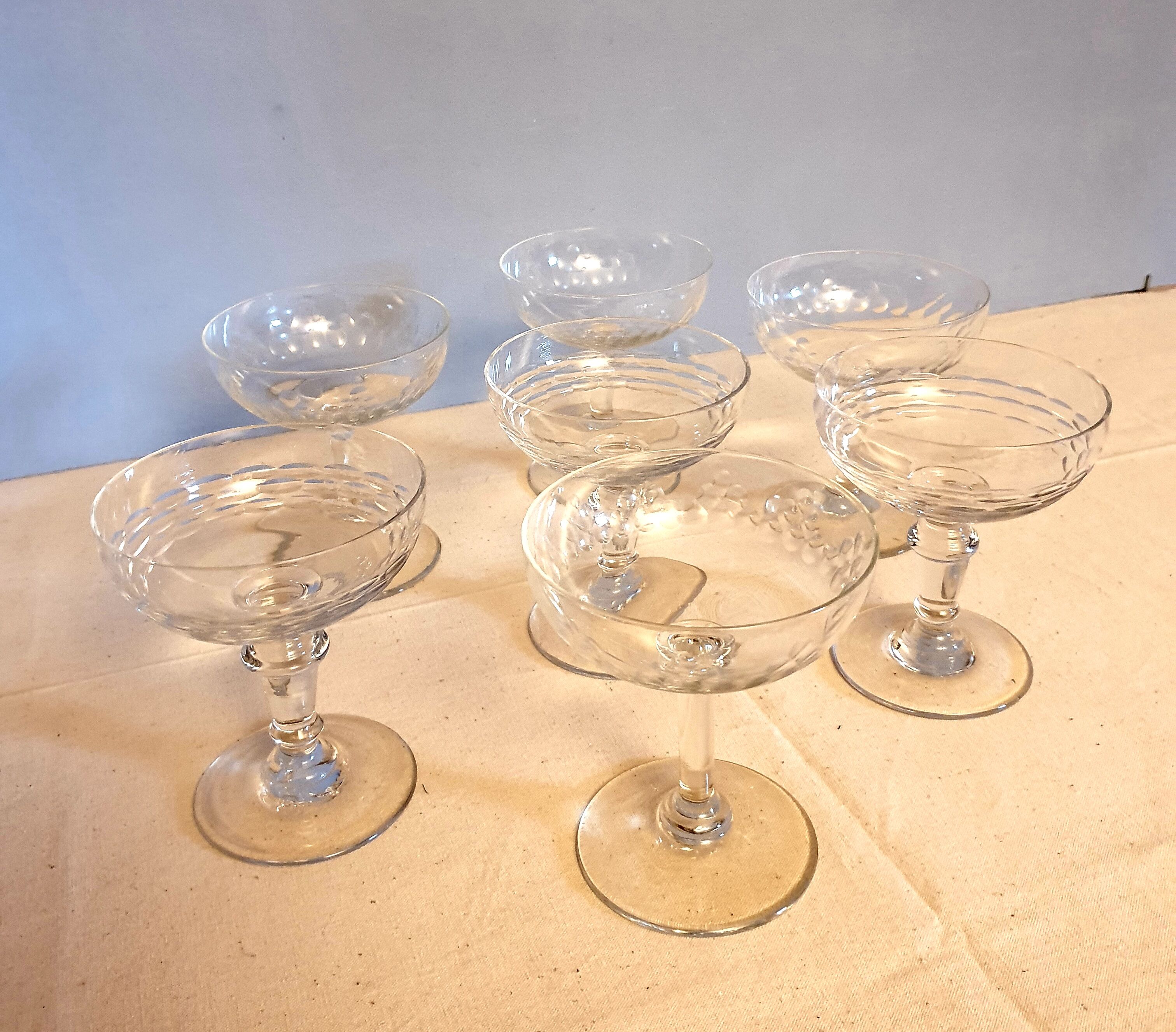 Assorted 7 engraved crystal Champagne cups.