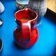 Max Idlas, large burgundy ceramic pitcher, France, 1960s