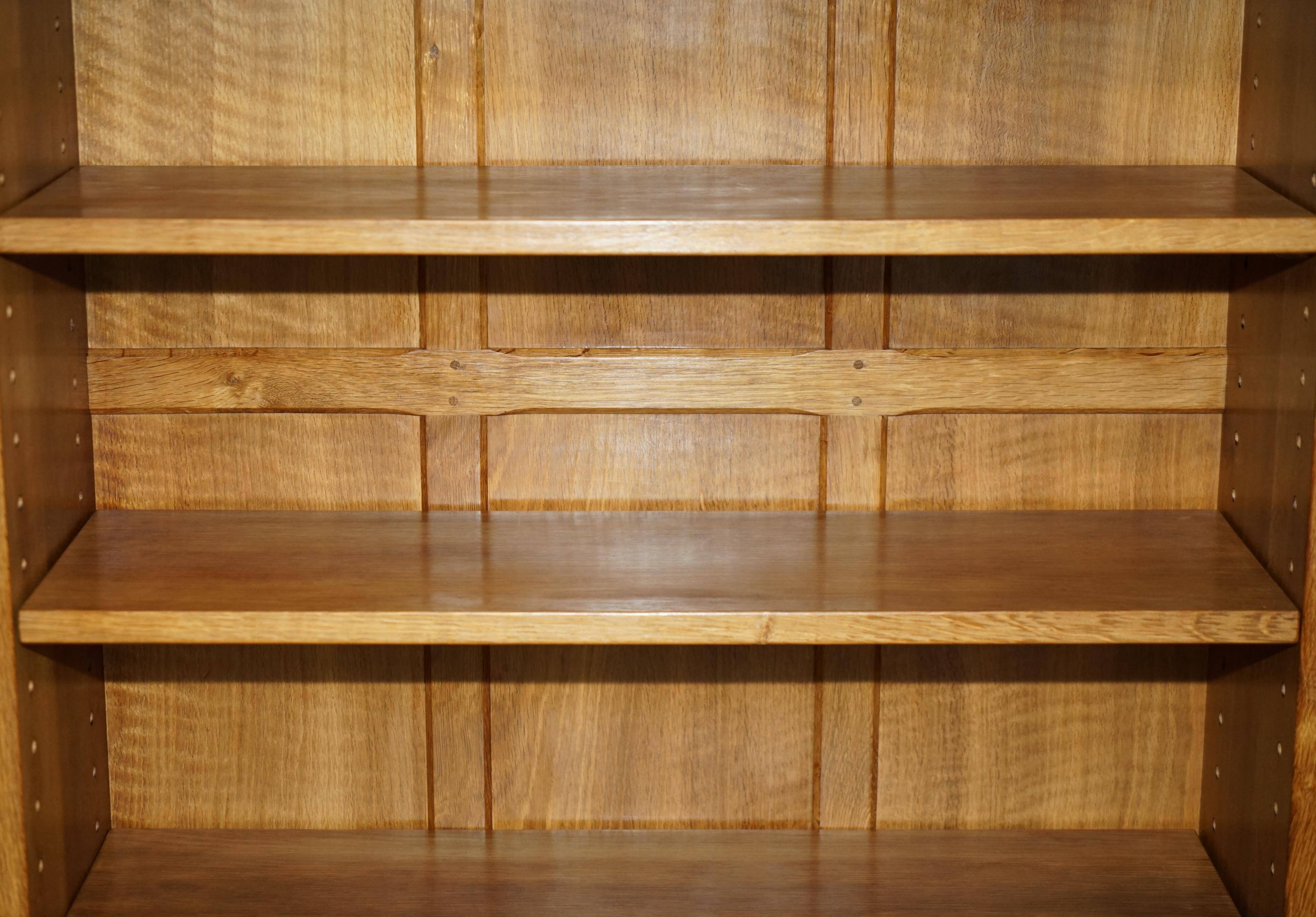 Pair of Robert Mouseman Thompson oak carved bookshelves.