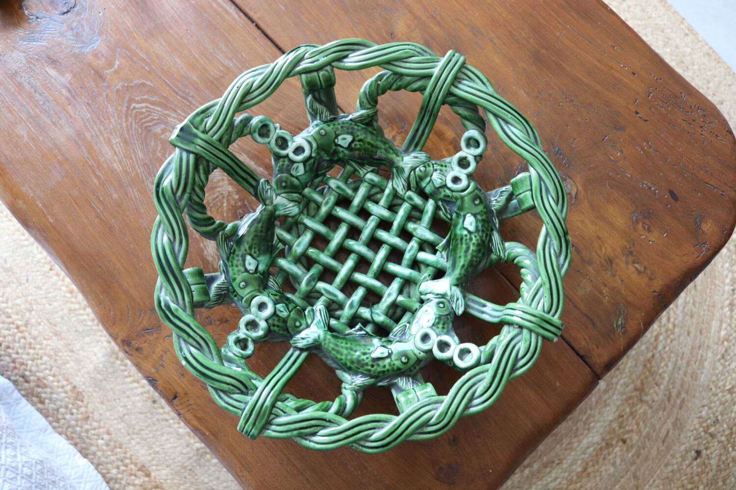 Antique woven basket in green glazed ceramic, fish decoration
