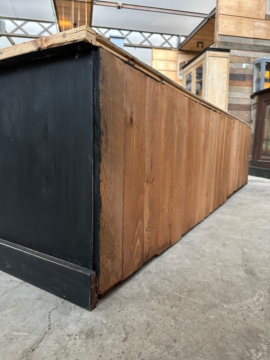 Old workshop furniture transformed into a TV unit.