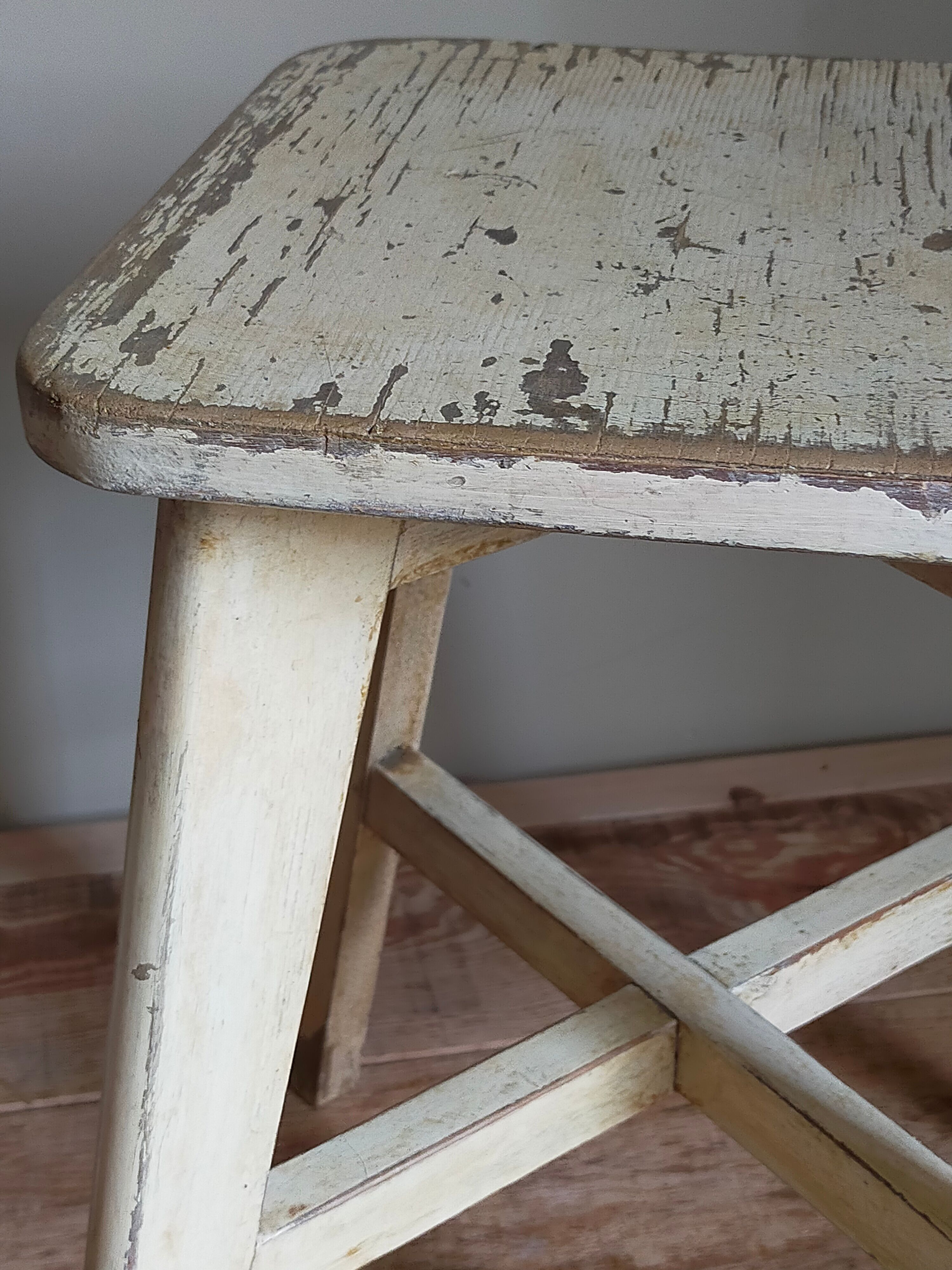 Old workshop stool in patinated solid wood