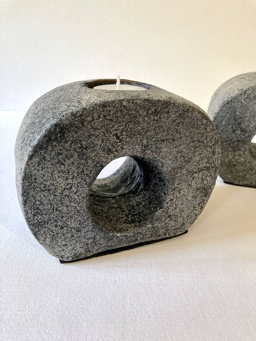 Pair of terracotta candle holders with anthracite finish, 1980s.