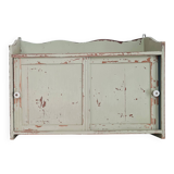 Small old wall shelf with sliding doors