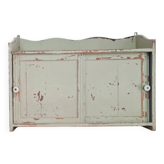Small old wall shelf with sliding doors