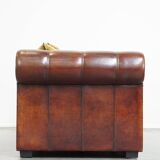 Luxurious and spacious two-seater sheepskin sofa of top quality with fabric cushions