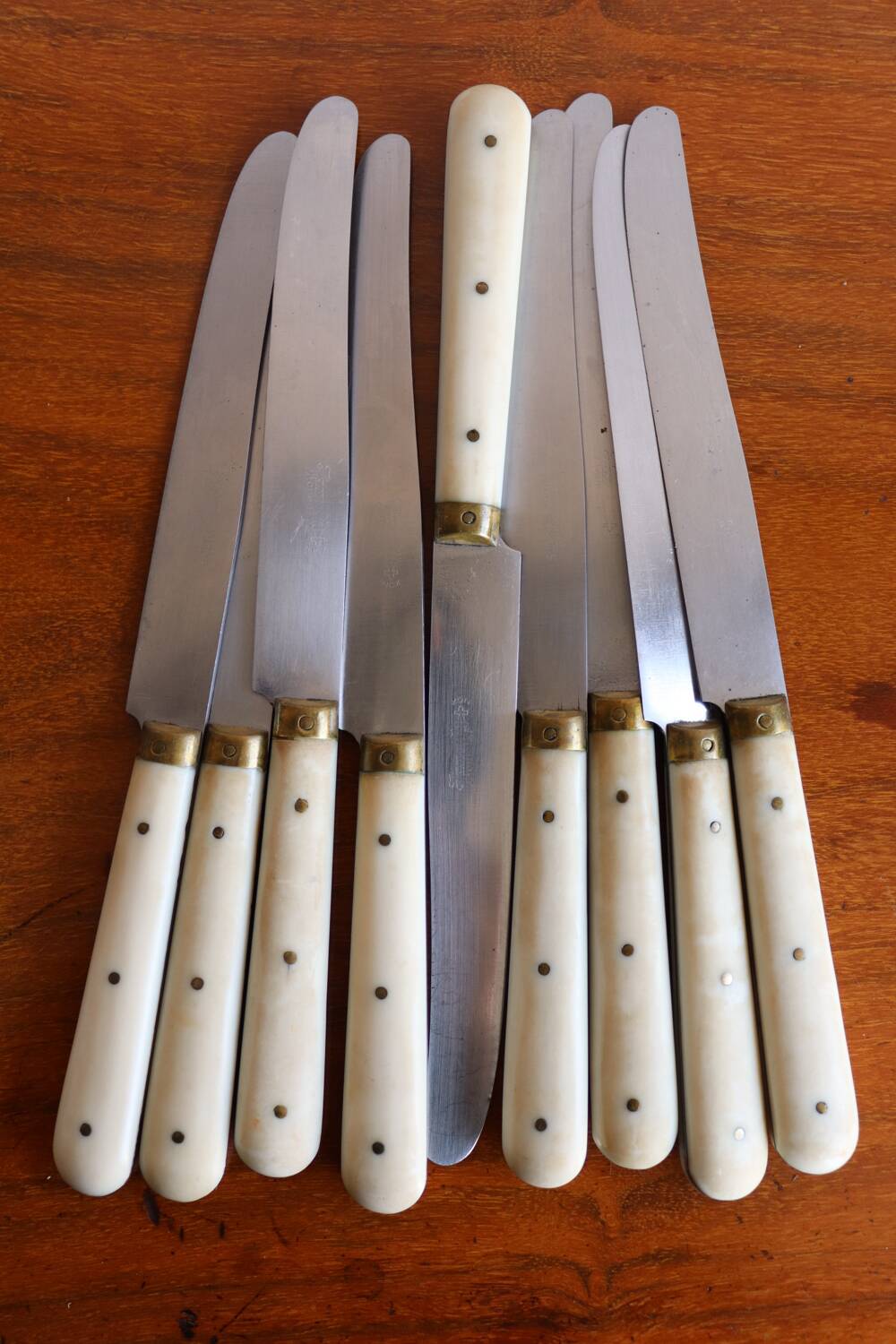 Set of 9 vintage cream table knives