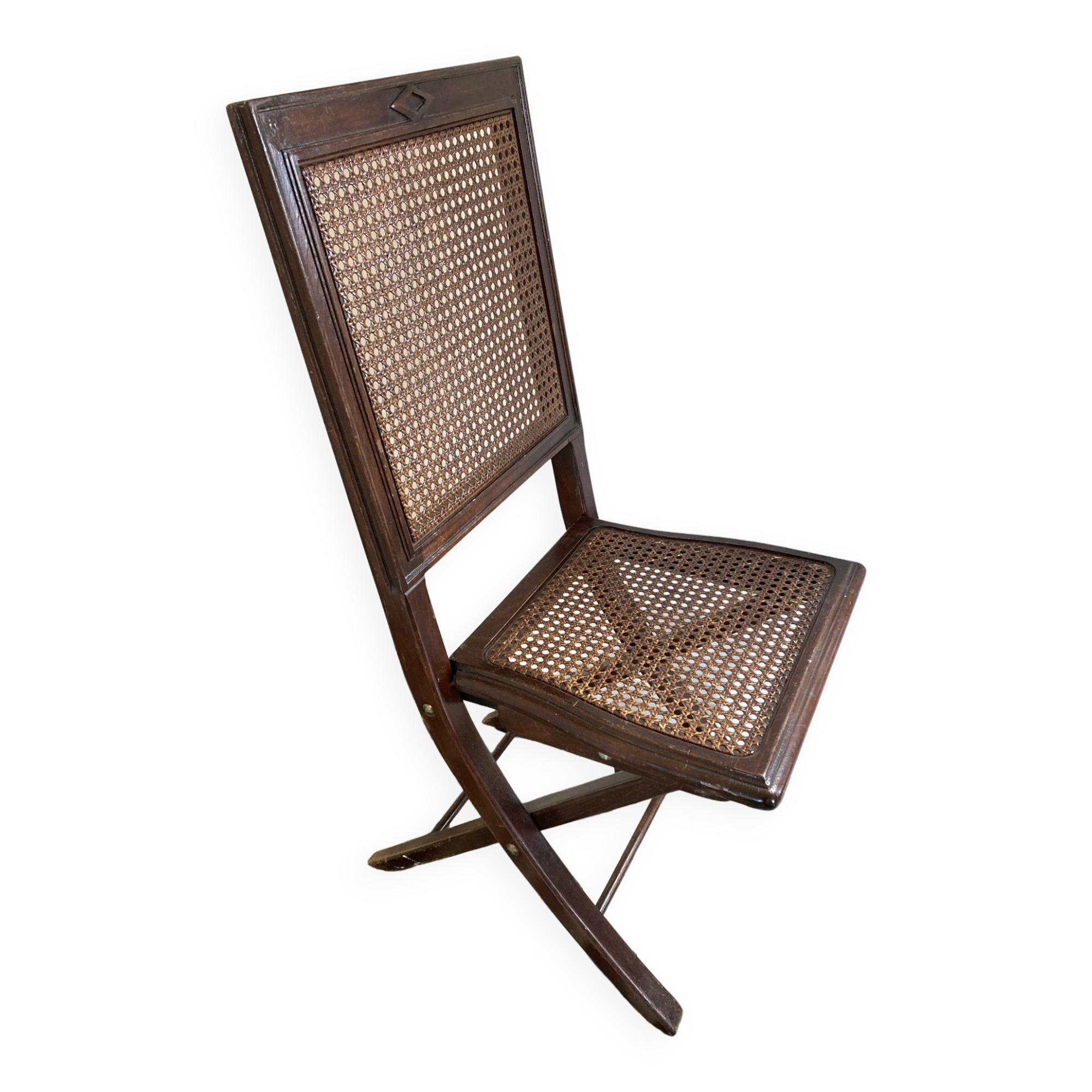 Vintage folding chair with cane seat in dark mahogany wood