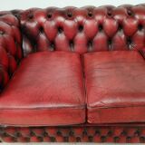 Three-seater red leather chesterfield sofa