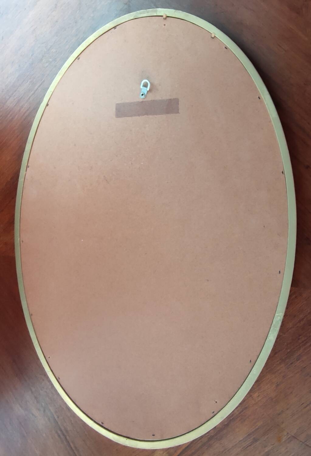 Old oval beveled golden mirror