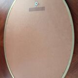 Old oval beveled golden mirror