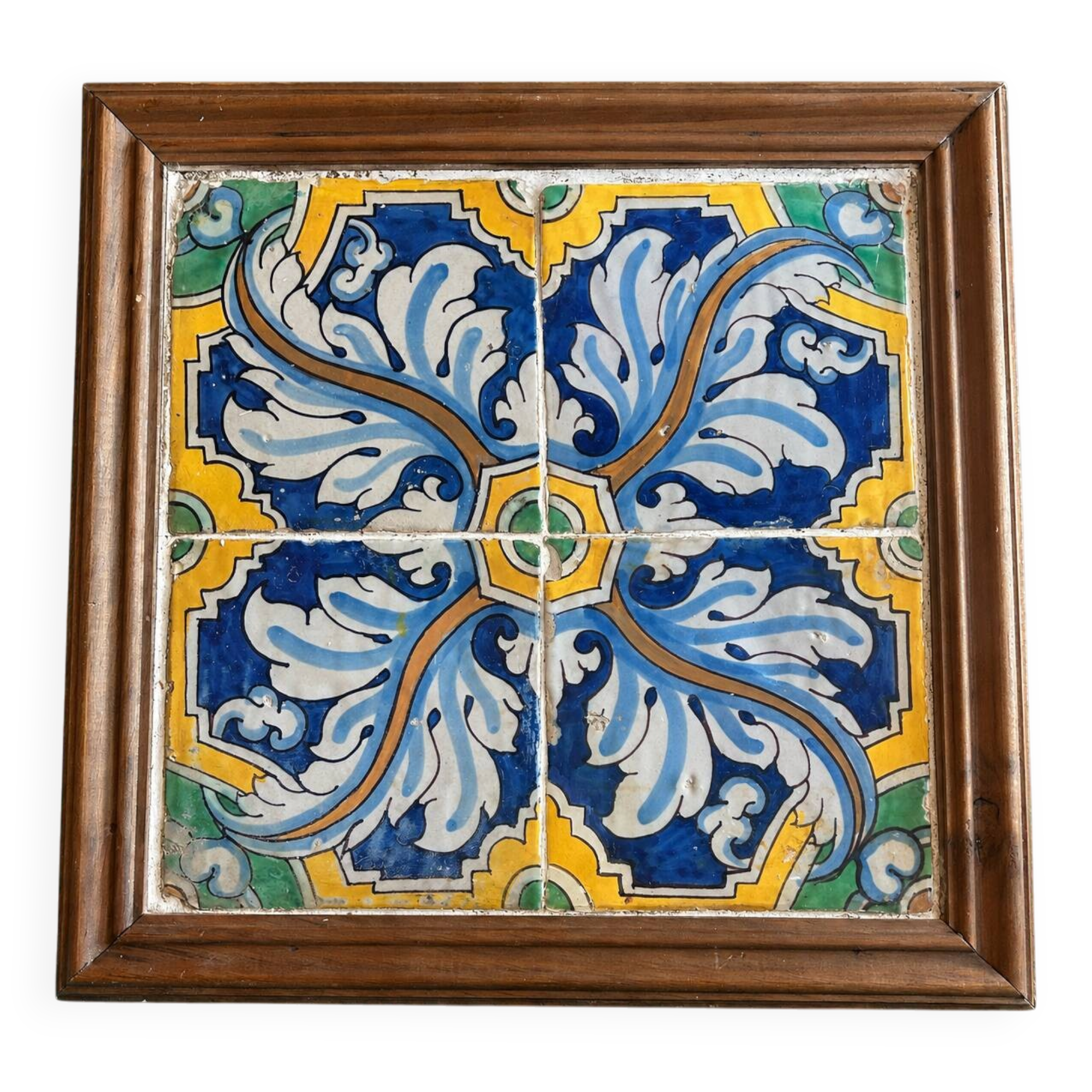 Panel of four Catalan tiles, 17th century, framed.