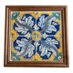 Panel of four Catalan tiles, 17th century, framed.
