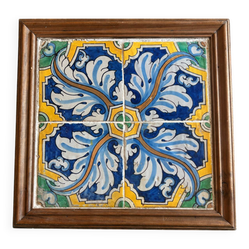 Panel of four Catalan tiles, 17th century, framed.