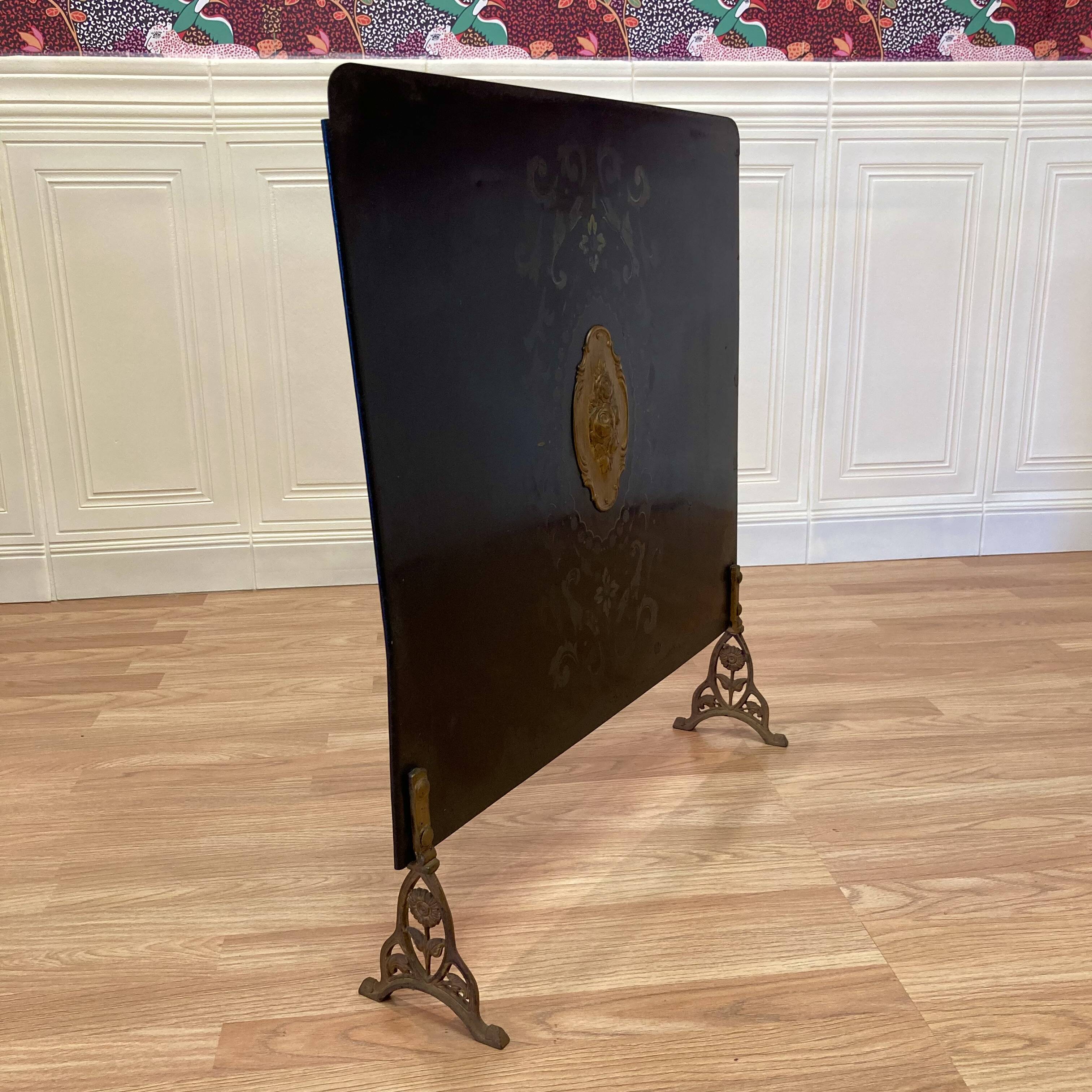 Antique metal fireplace screen.