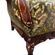 Vintage baroque chair with a rich floral pattern