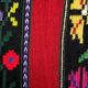 Romanian wool rug, red background with delicate colourful flowers