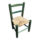 Vintage children's chair in solid wood with a straw seat in green.
