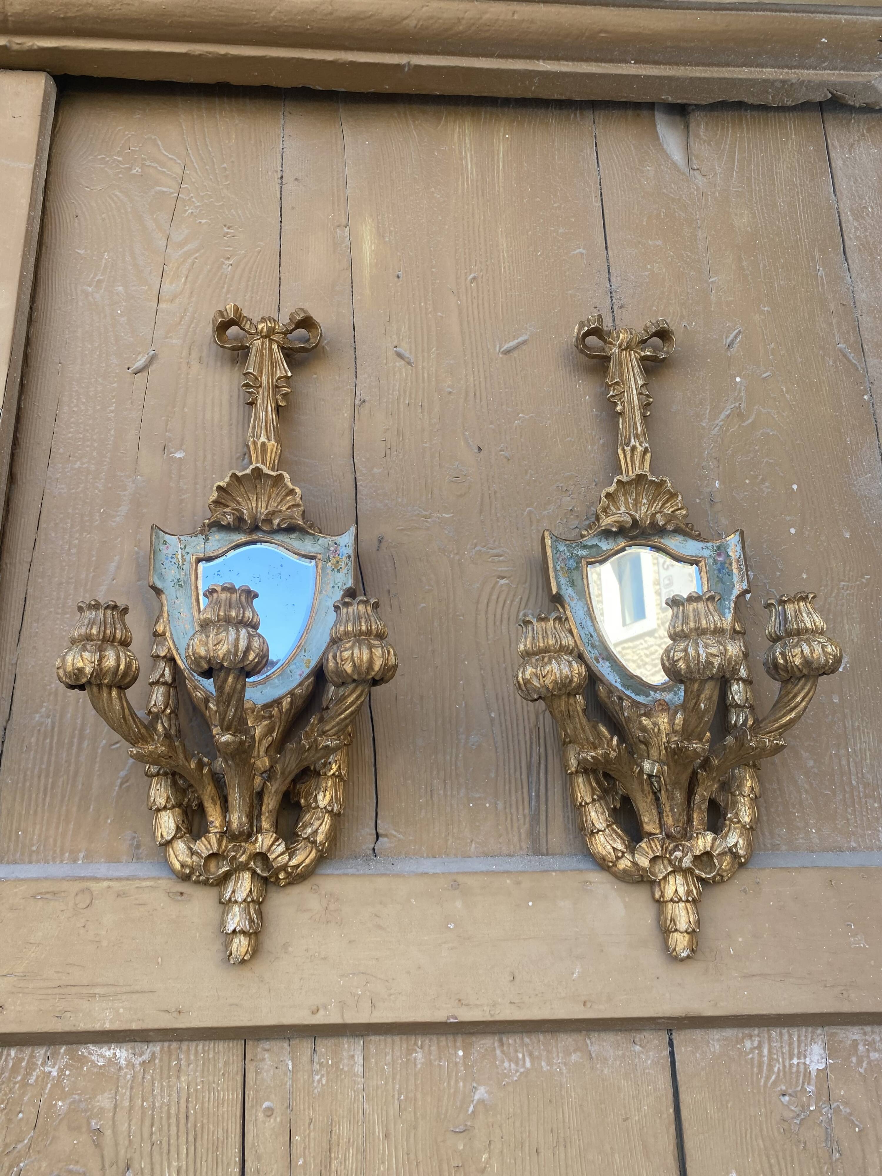 Pair of carved wood sconces