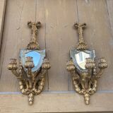 Pair of carved wood sconces