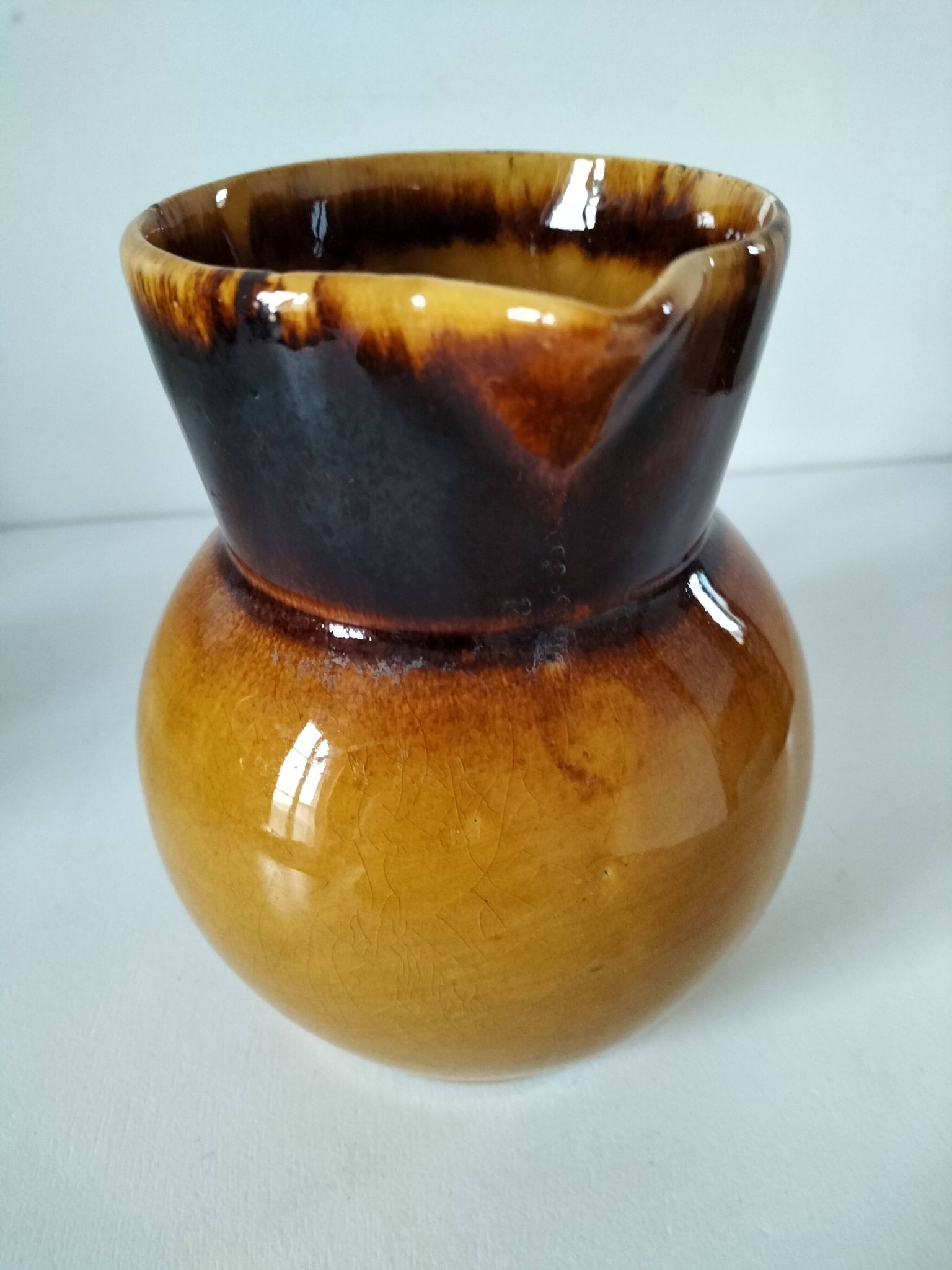 Glazed earthenware jug