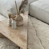 Pair of triangular travertine tables