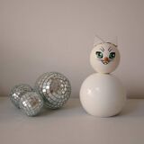 Wooden piggy bank, white cat