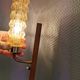 A set of Danish wall lights in champagne coloured glass with brass and teak.