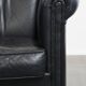 Black cowhide club chair in English style with a great luxurious design