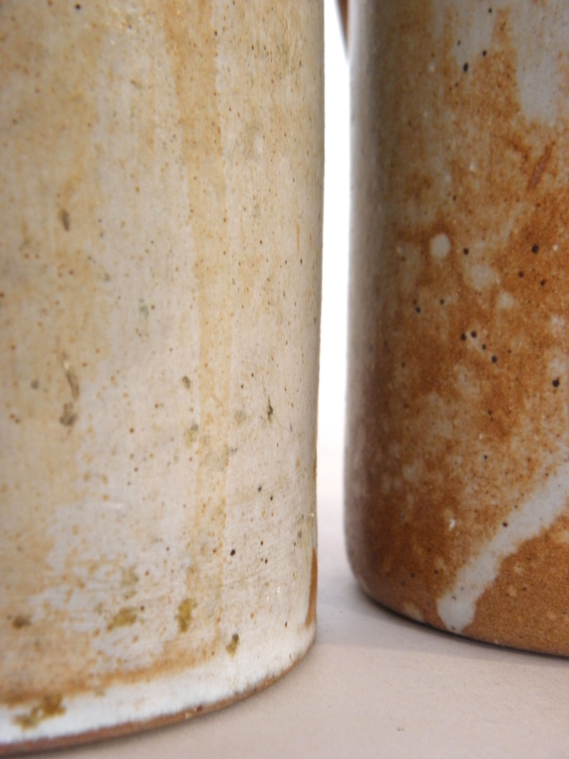 Decanter and enamelled stoneware mugs