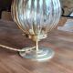 Globe table lamp in amber chiseled glass