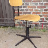 workshop chair adjustable in height, metal footing and seating and wooden back