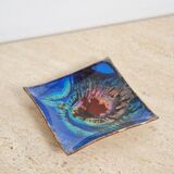 Empty pocket in psychedelic enamelled leather