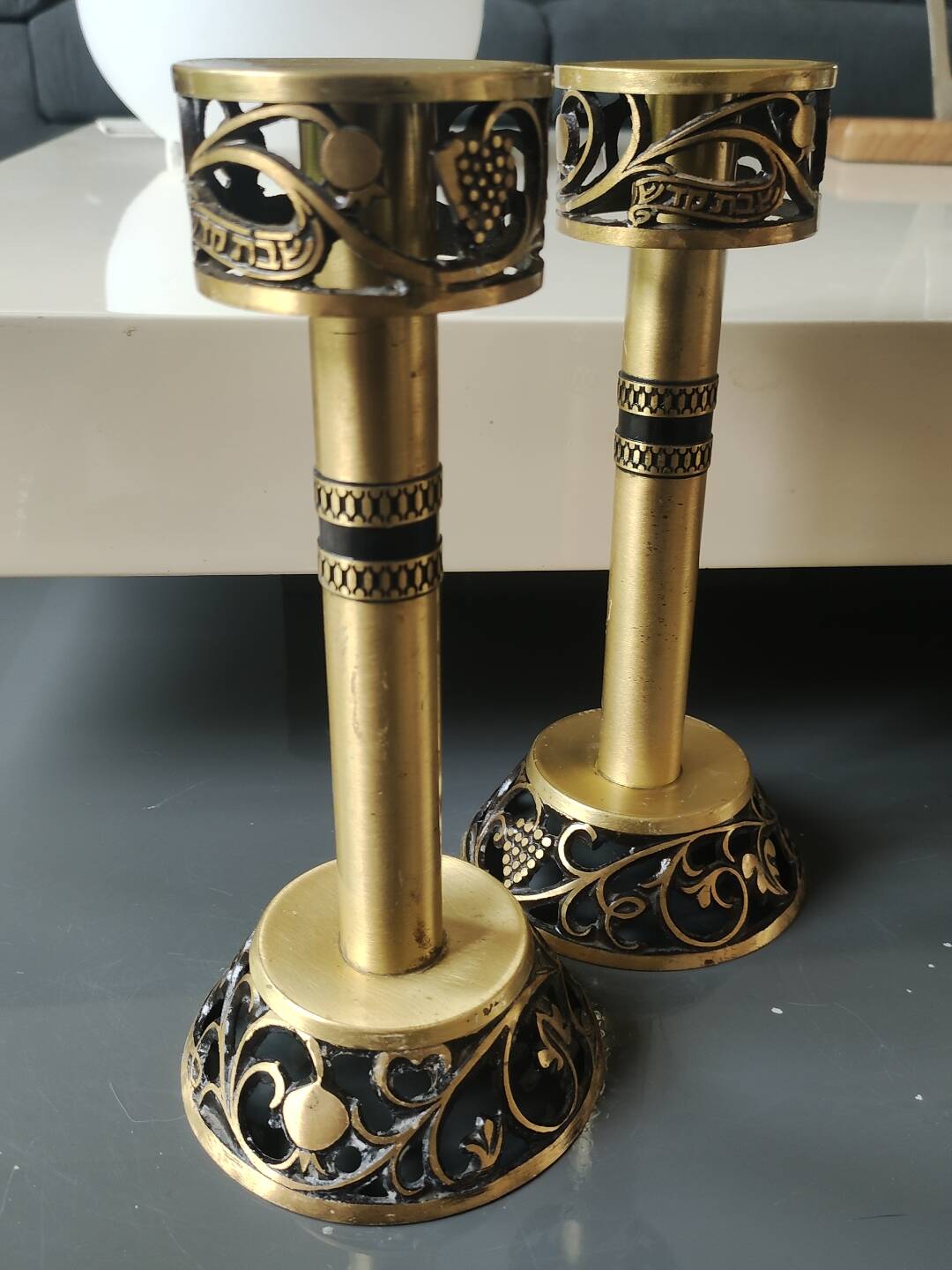Pair of Hebrew Candlesticks. In antique gold-plated brass. Signed FFS Israel