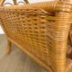 Vintage caramel-colored bamboo and rattan magazine rack