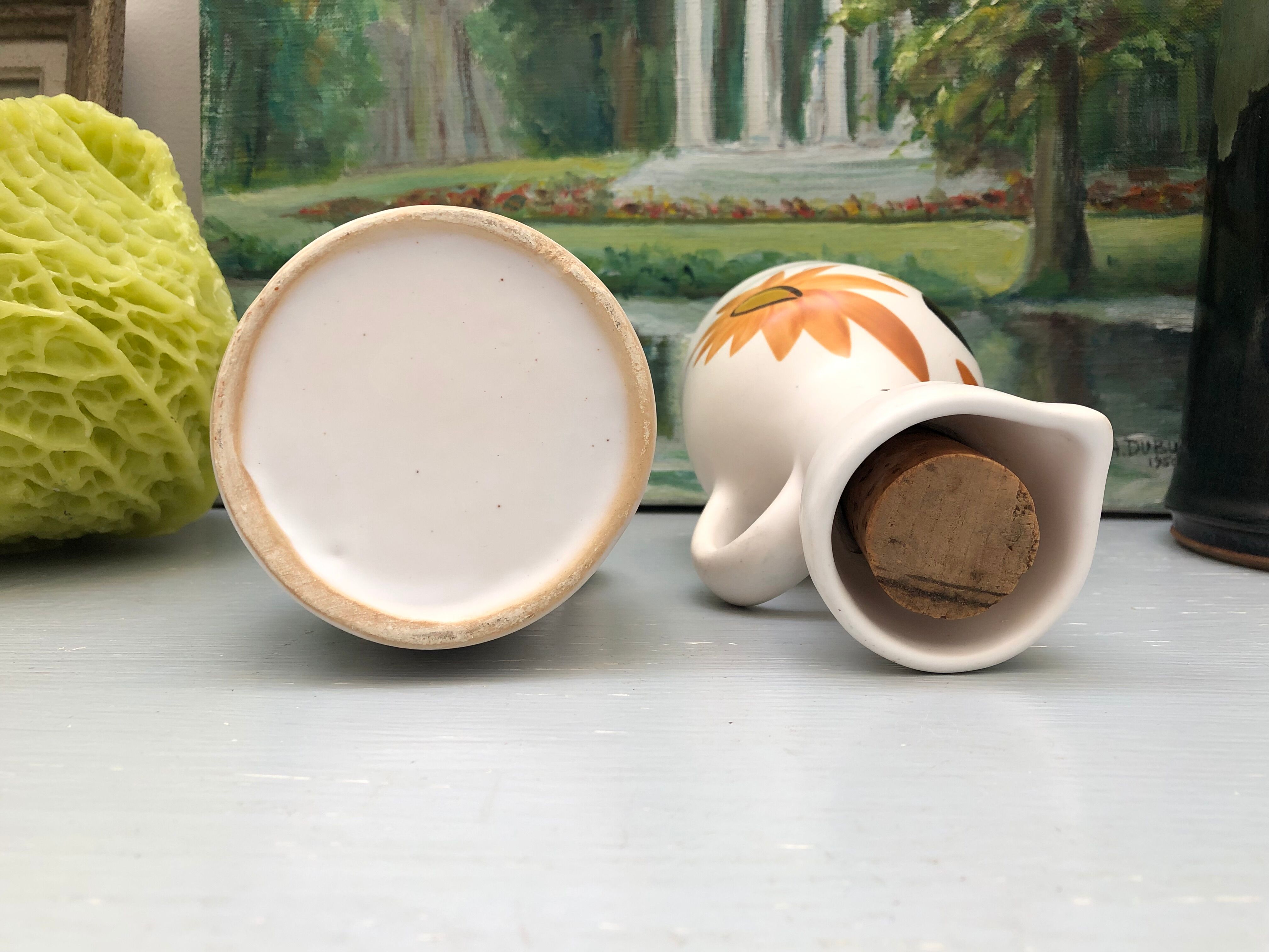 Old vinegar and oil maker with vintage decoration floral motifs