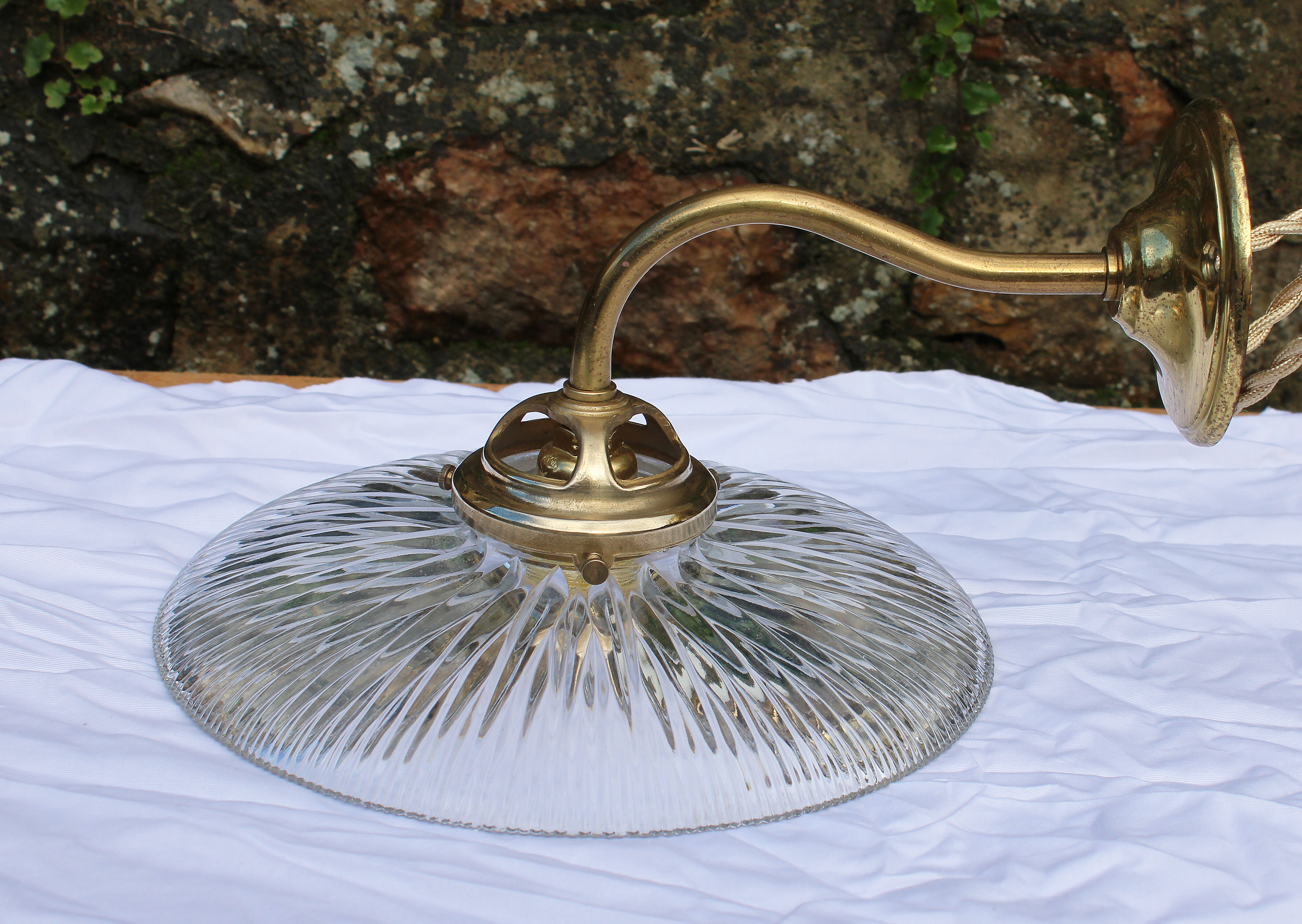 Holophane glass and brass wall light